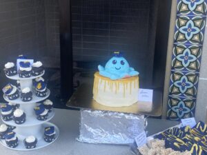 finished cake, yellow drips and blue octopus on top